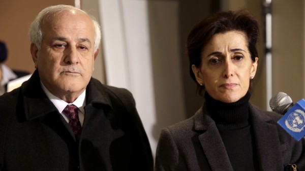 Palestinian Ambassador to the United Nations Riyad Mansour, left, and Jordanian Ambassador Dina Kawar talk to reporters after a meeting of Arab states at U.N. headquarters, Monday, December 29, 2014. (Photo: Seth Wenig/AP)