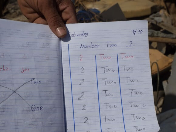 English class homework found in a small backpack amid the rubble of Hassan home, Gaza, photo by Dan Cohen