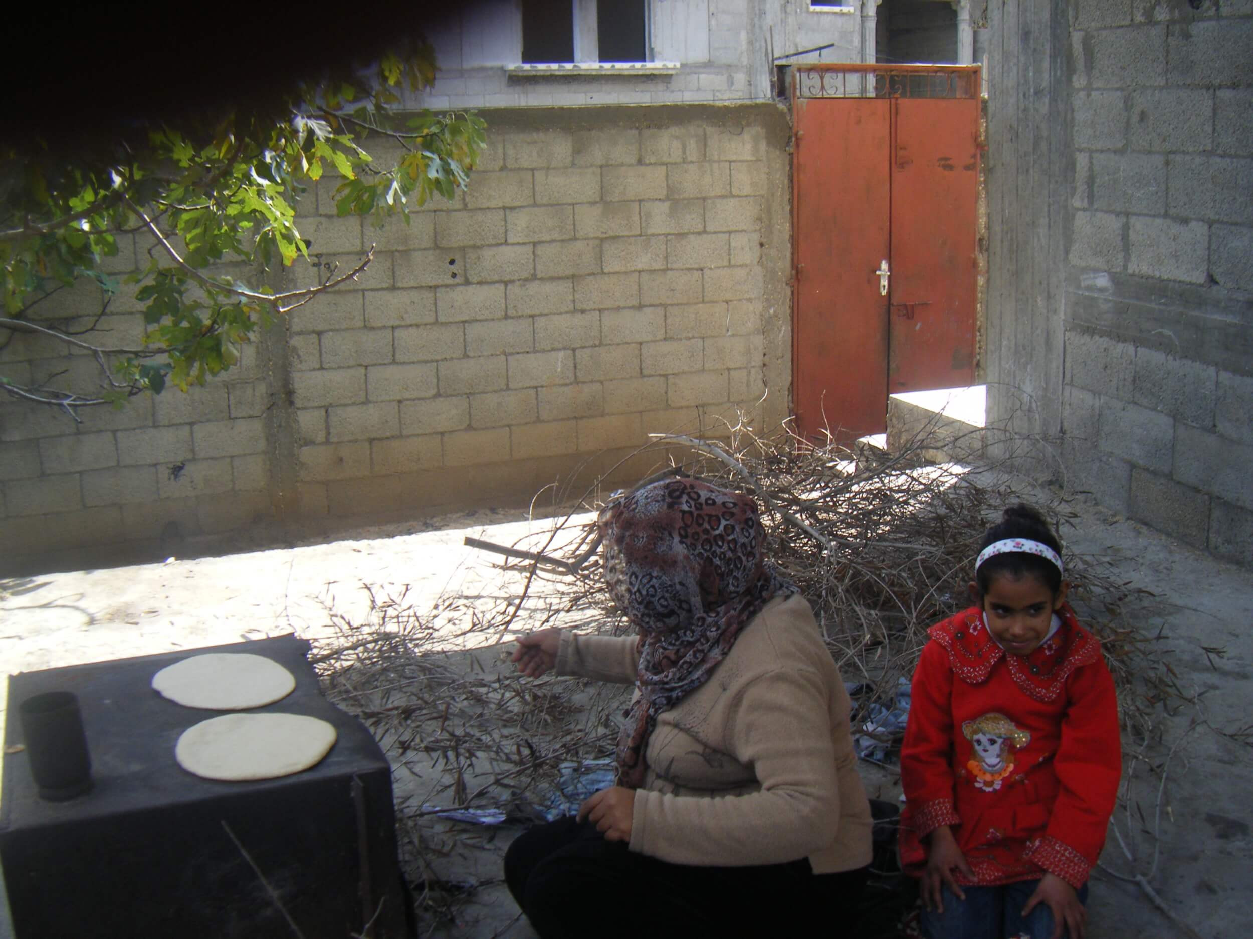 A woman in Gaza bakes using a traditional wood burning oven due to the electricity crisis. (Photo: Isra Saleh El-Namy)