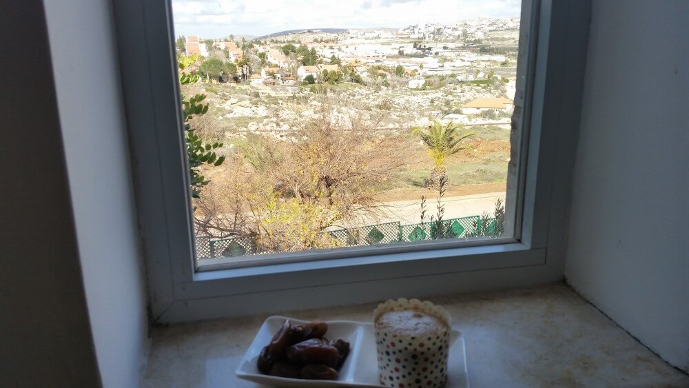 Breakfast of dates and muffin in Ofra settlement