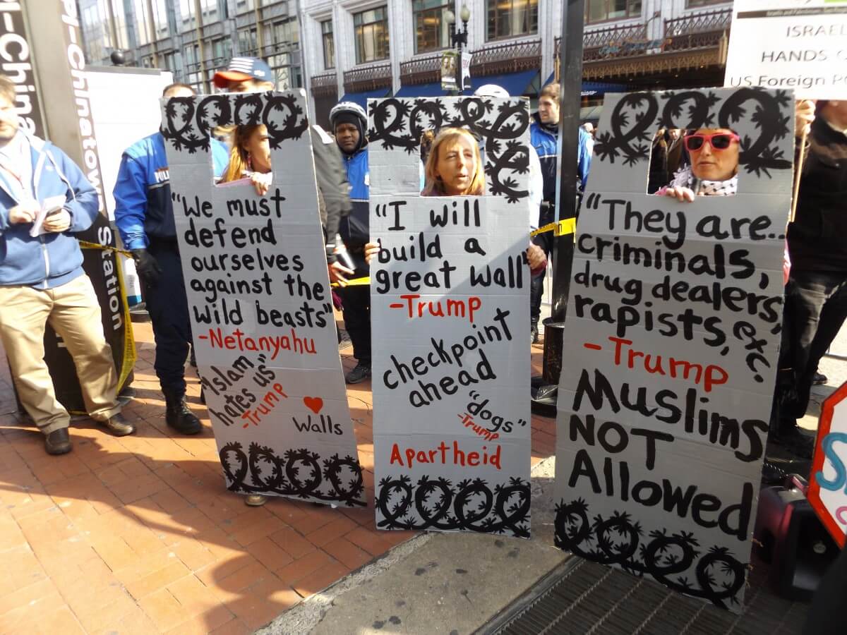 Code Pink co-founder Medea Benjamin and two other protesters assembled on the sidewalk next to the Verizon Center, imploring AIPAC members to see Donald Trump as a common enemy. Many attendees told me they just wanted to hear what Trump has to say. (Photo: Wilson Dizard)