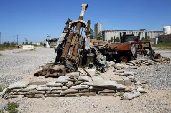 A burned Humvee and artillery are seen at the peshmerga base in Makhmour, after it was freed from control of Islamic State, south of Mosul, April 17, 2016. (Photo: Ahmed Jadallah/Reuters)