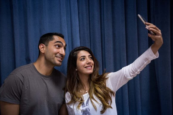 BETHLEHEM, PALESTINE - MAY 23: Festival participant Remi Kanazi poses for a selfie with a student at Bethlehem University on May 23, 2016 in Bethlehem, Palestine. (Rob Stothard for The Palestine Festival of Literature)
