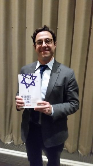 Dov Waxman, with his book, Trouble in the Tribe