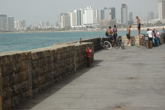 Youth jump from the sea wall at north end of the Jaffa Port into the Mediterranean Sea. (Photo: Allison Deger)