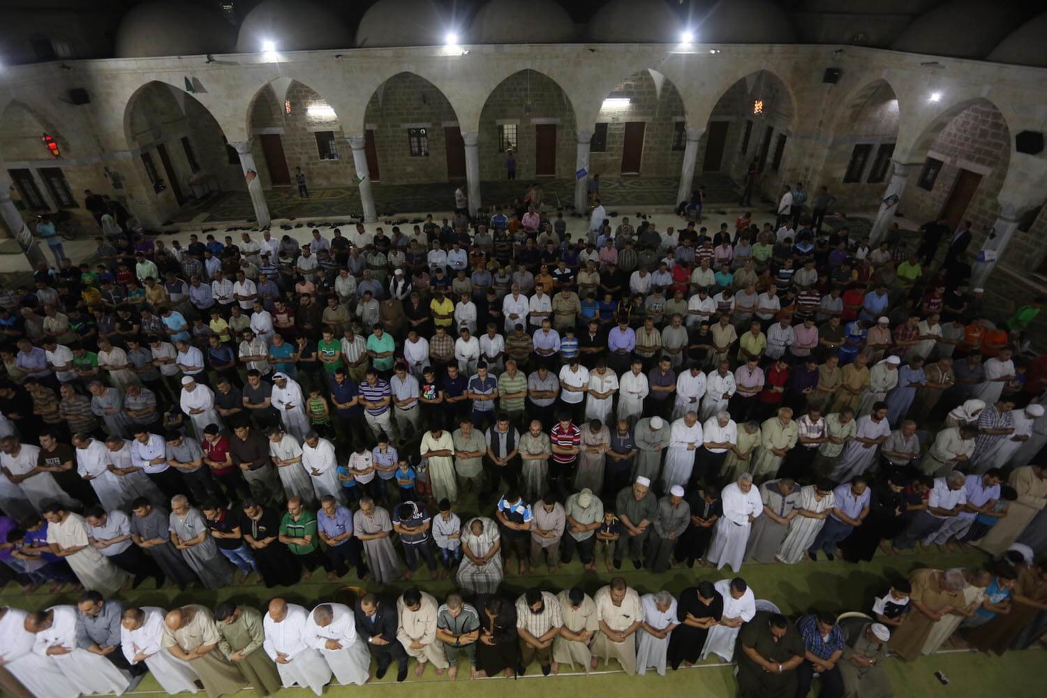 Muslims in Gaza pray inside of a mosque during the religious month of Ramadan, June 2016. (Photo: Mohammed Asad)