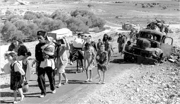Palestinian refugees in 1948 leaving the Galilee. (Photo: Fred Csasznik/Wikimedia Commons)