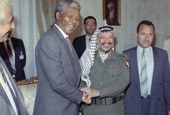 Nelson Mandela meets with Palestinian Liberation Organization Chairman Yasser Arafat, right, on Sunday, May 20, 1990 in Cairo. (Photo via news.naij.co) 