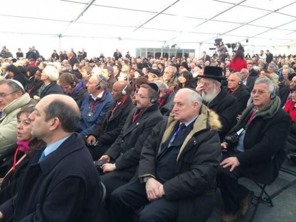 Malcolm Hoenlein of Conference of Presidents, seated amid Israeli Knesset at Auschwitz, photo by Shmuley Boteach