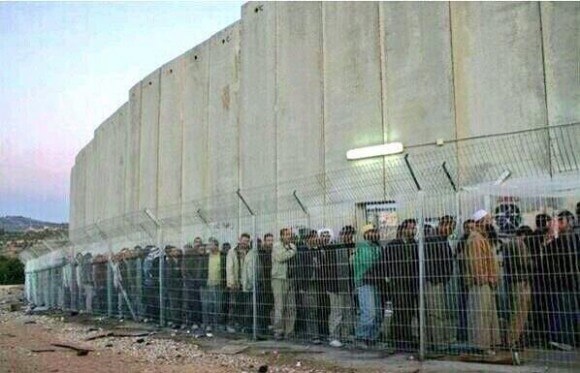 Photo of Palestinians at a checkpoint beside the wall. H/t KR twitter feed, and Scott Roth