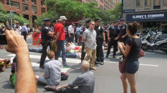 Corey Robin is led away by police. (Photo: Eamon Murphy)
