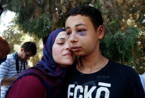 Tarih Abu Khdeir is met by his mother after his release from jail in Jerusalem on Sunday. (Photo: Reuters)