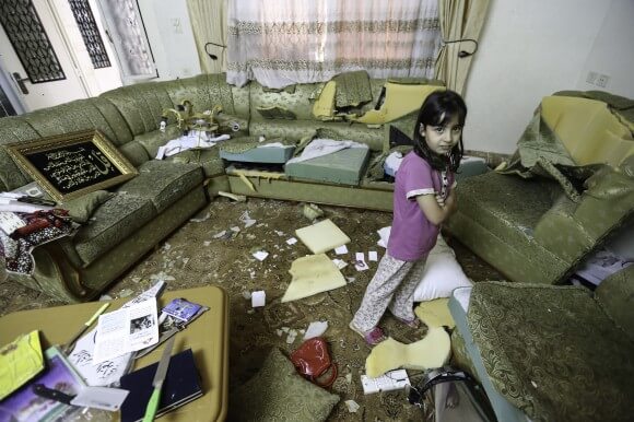 Israeli soldiers used knives from the kitchen to destroy furniture throughout the Qawasmeh  home. (Photo: Kelly Lynn)