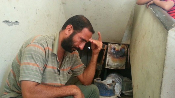 Hamed Alsheikh Khalil weeping over his killed family. (Photo: Mohammed Alafifi)