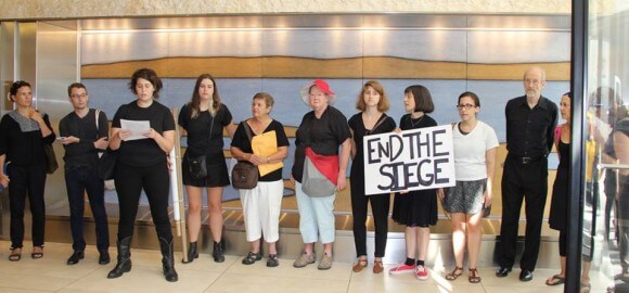 Jewish Voice for Peace members call for an end to the blockade of Gaza inside the UJA-Federation building in New York. (Photo: Jewish Voice for Peace NY/Facebook)