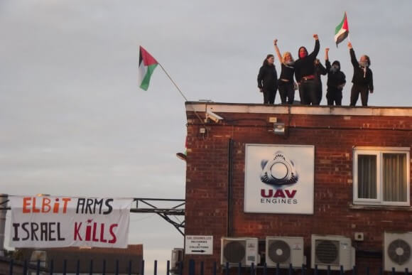 Activists occupying roof of UAV Engines, wholly owned subsidiary of Elbit. (Photo: London Palestine Action)