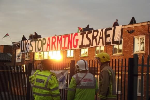 Police look on as protesters occupy the roof of an Elbit owned factory in Birmingham. (Photo: London Palestine Action)