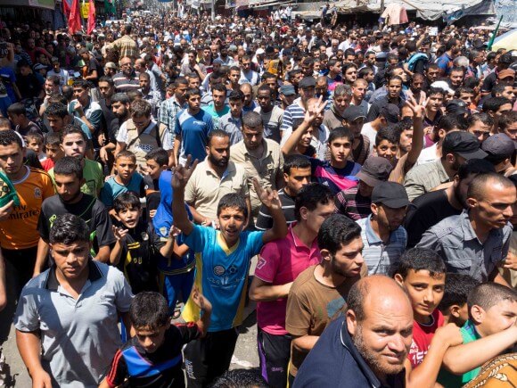 Thousands of mourners packed the streets of Rafah to pay tribute to the Hamas commanders Muhammad Abu Shammala, Raed al-Attar and Muhammad Barhoum. (Photo: Dan Cohen)