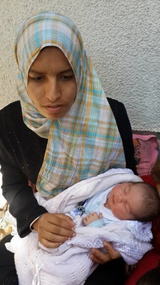 Safa Elfaramawi, 23, is from Zalata (Rafah) in the Gaza Strip. Her baby was born on July 25, 2014 in a UN shelter after her home was destroyed by Israeli fire  (photo: Hedaya Shamun)