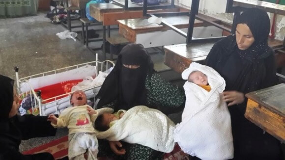 Palestinian mothers who recently gave birth at the UN shelter in Rafah, Gaza