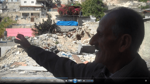 abu Diab Silwan, before a demolished house