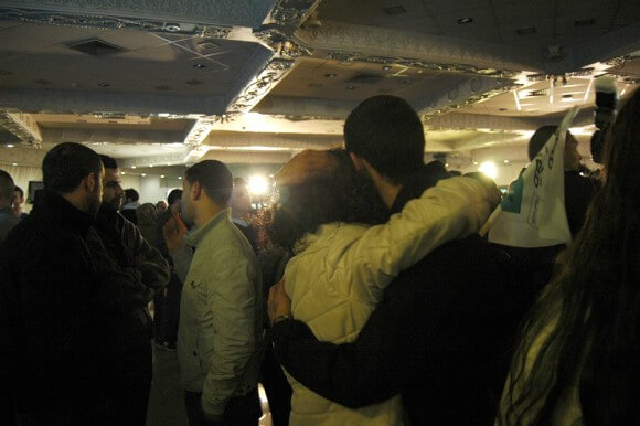 Joint Arab List supporters embrace after election results are announced, Nazareth, Israel, Tuesday, March 17, 2015. (Photo: Allison Deger)