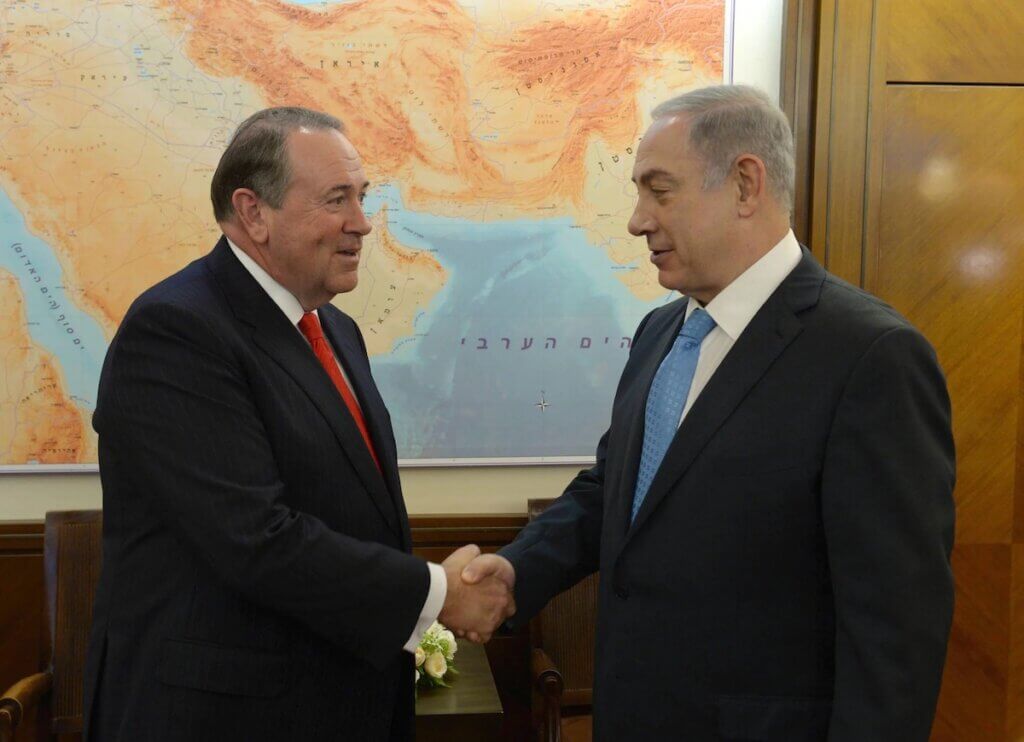 Former governor of Arkansas and GOP presidential contender Mike Huckabee with Israeli Prime Minister Benjamin Netanyahu, August 2015. (Photo: Amos Ben Gershom / GPO)