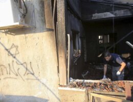 Israeli police investigate the damage of the Dawabshe family home in Duma, firebombed on July 31, 2015. The graffiti the assailants sprayed reads: "revenge." (Photo: Reuters)