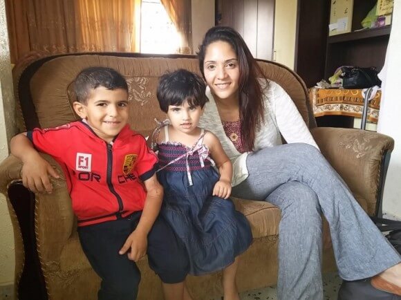 Dr. Bahar Al Hashemi with Yamen and Janna, were pulled out of the rubble after their three level family home collapsed last year killing 19 of their family members. (photo: C4G)