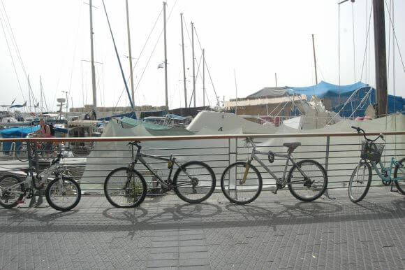 Bicycles rest against a rail at the Jaffa Port, May 14, 2016. (Photo: Allison Deger)