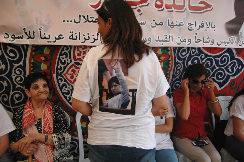 Khalida Jarrar's sisters wear shirts with a photo of the in court parliamentarian. (Photo: Allison Deger) 