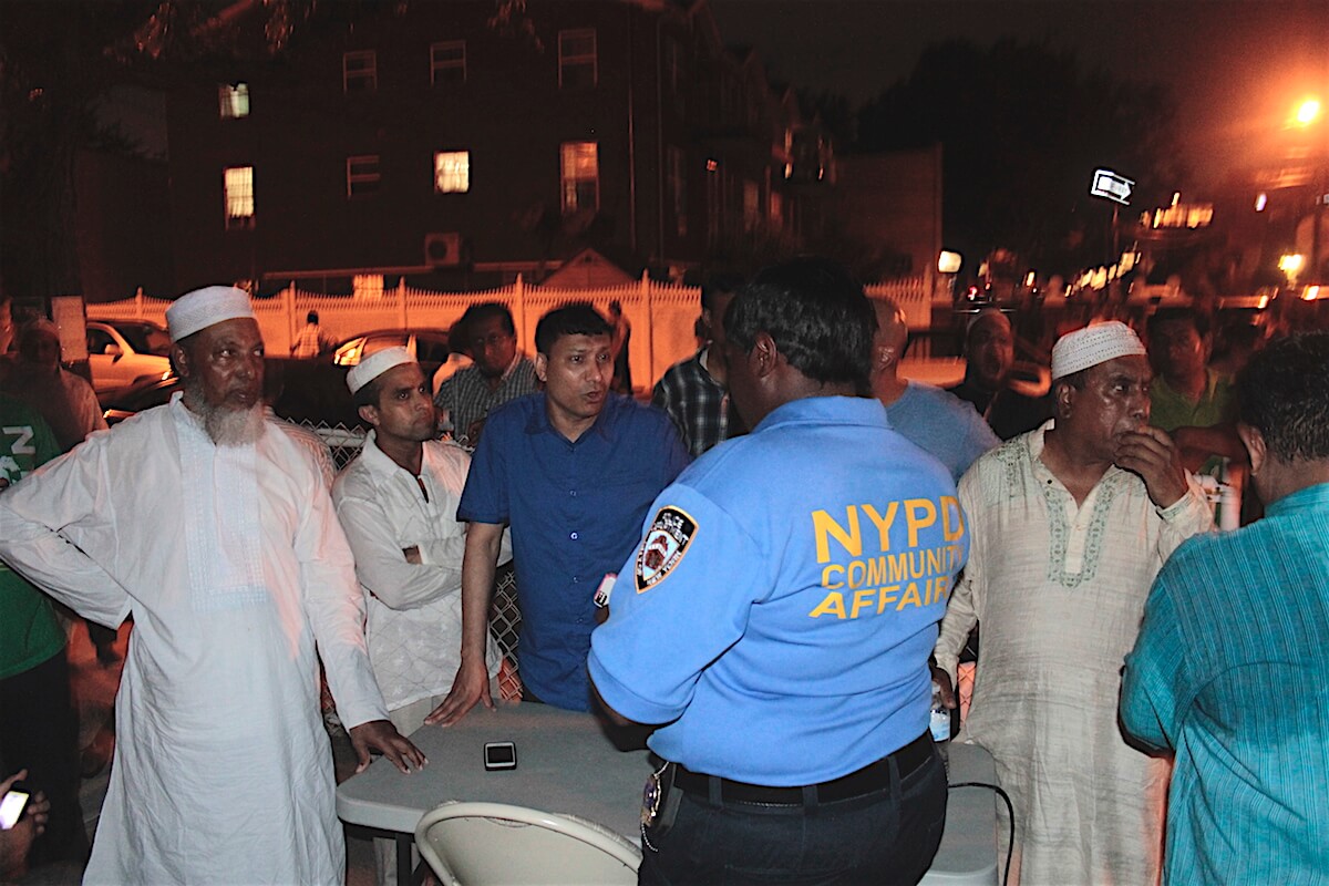 Bengali Americans talk to an NYPD community affairs officer. (Photo: Wilson Dizard)