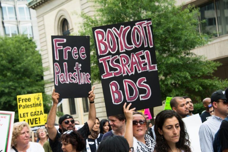 Activists call for boycotting Israel. (Photo via BDSMovement.net)