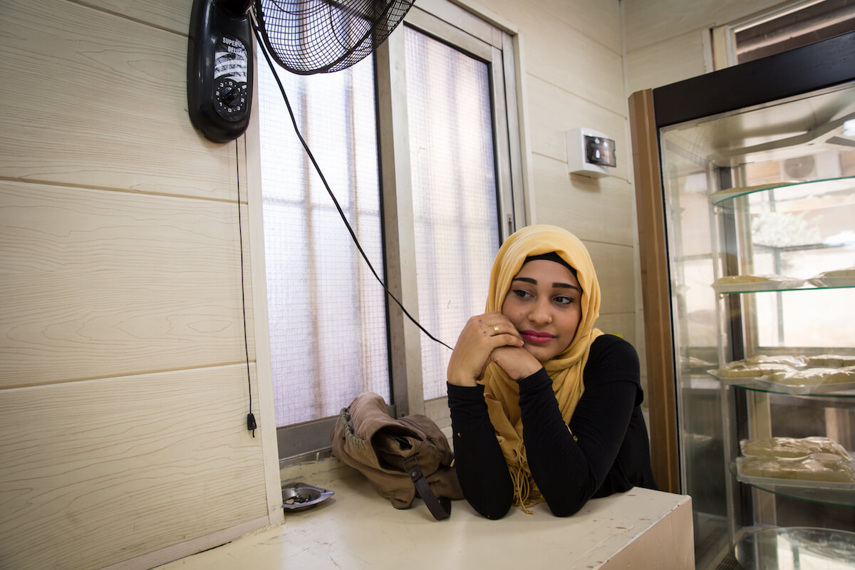 Bourj el Barajneh Camp, Beirut, Lebanon - 15/10/2016: Marwa Ayoub, 19 years old from Akka works in a sweet shop in the camp. “My parents told me Palestine has beautiful homes, fields but we have forgotten our traditions, we have forgotten everything. I have seen the ancient ruins on video, I would love to see them myself, nobody is happy here.” (Photo: Celia Peterson)