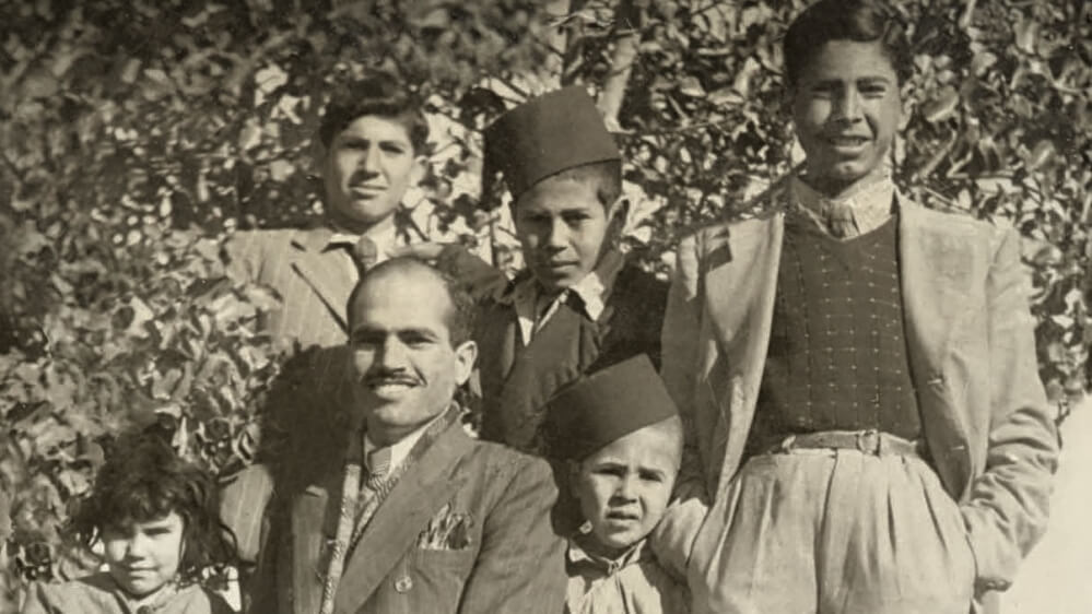 Salman Abu Sitta (center) in the village of al-Ma'in with his family, 1944. (Photo courtesy of Salman Abu Sitta)