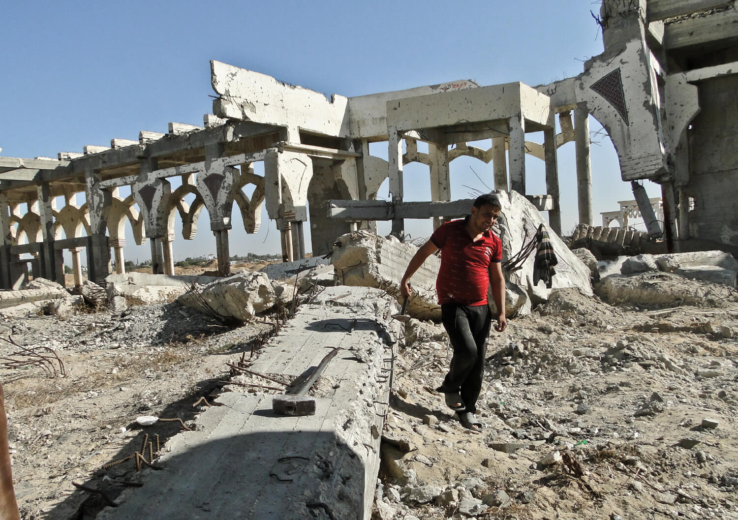 A Palestinian man walks through the ruins of the Gaza International Airport. Israeli forces flattened the buildings and destroyed the tarmacs in a 2001 incursion during the second Intifada. (Photo: Mohammed Asad)