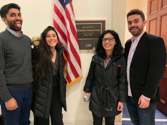 Members of Justice Democrats pose in front of Rep. Ocasio-Cortez's new Congressional office. (Photo: Alexandra Rojas, Twitter)