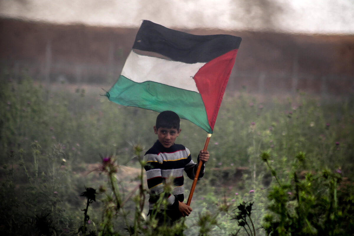 A Palestinian youth protesting as part of the Great March of Return in Jabalia in the northern Gaza Strip on March 30, 2019.