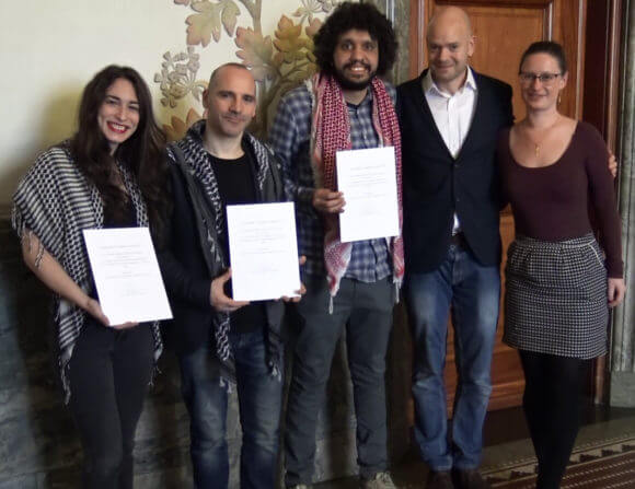 The Humboldt 3, Stavit Sinai, Ronnie Barkan, and Majed Abusalama, receive an award from Copenhagen’s Mayor for Technical and Environmental Affairs
