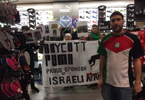 Protesters call for a boycott of the brand Puma over its sponsorship of the Israeli Football Association. (Photo: Manchester Action Palestine)