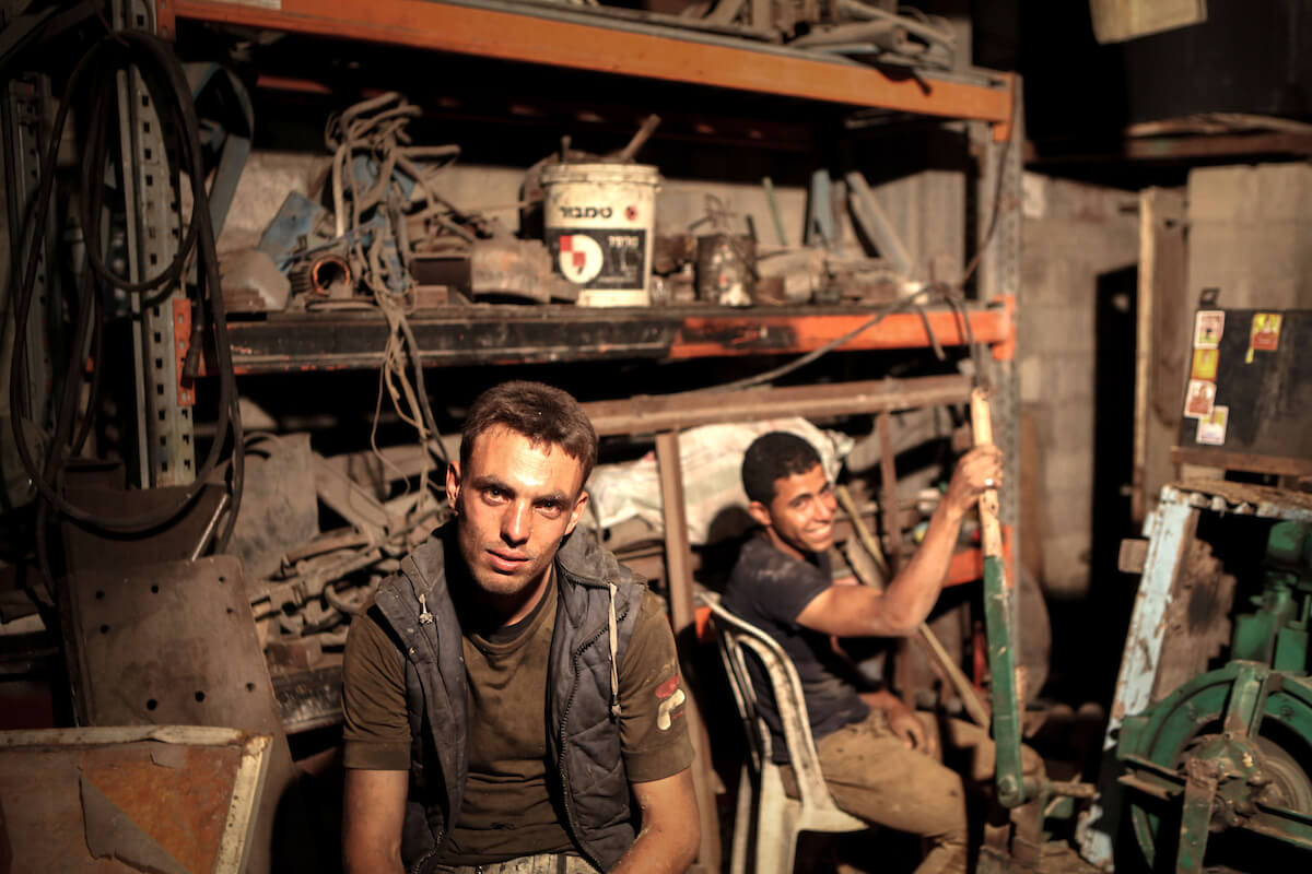 Palestinian workers drill water wells, in Gaza city, on June 01, 2014.