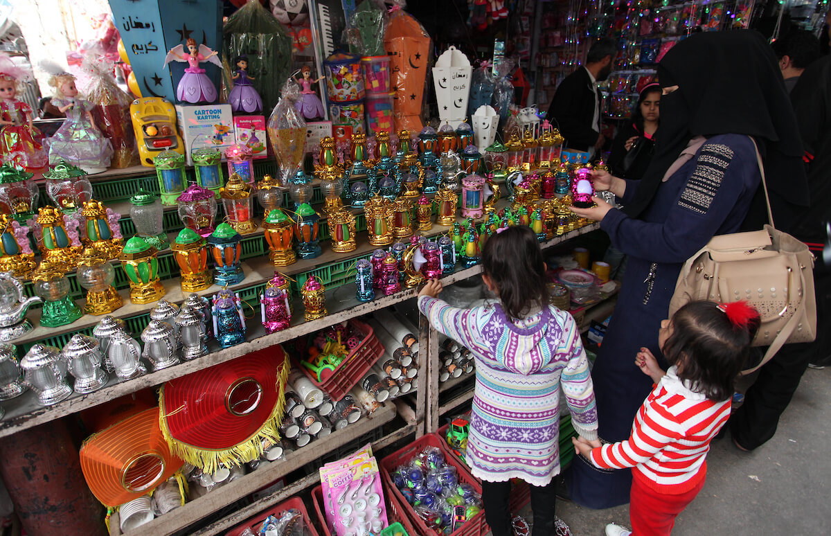 Palestinians shop for sweets at al-Zawya market during the holy month of Ramadan, in Gaza City on May 6, 2019. (Photo: Mahmoud Ajjour/APA Images)