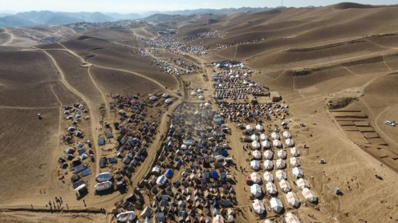 Drone footage of displaced family tents in one settlement in Badghis, Afghanistan, due to ongoing drought and climate change. There are thousands of makeshift homes spread between mountain hills on the outskirt of Qala-i-naw city. (Photo: Norwegian Refugee Council/Enayatullah Azad)