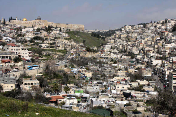 General overview of the East Jerusalem neighborhood of Silwan, with the Jerusalem's Old City and the Dome of the Rock in the background, March 2, 2010. (Photo: Mohamar Awad/APA Images)