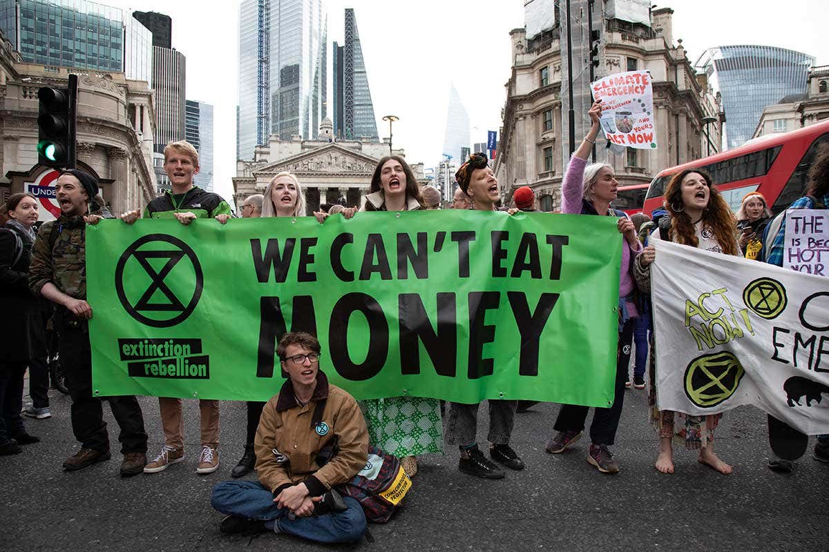 Activists with the organization Extinction Rebellion block the streets outside the Bank of England on April 25, 2019. (Photo: Mike Kemp via Getty Images)