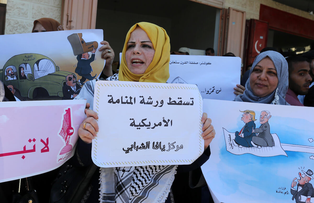 Palestinians protest against the Bahrain economic workshop, in Khan Younis in the southern of Gaza strip, on June 26, 2019. (Photo: Ashraf Amra)