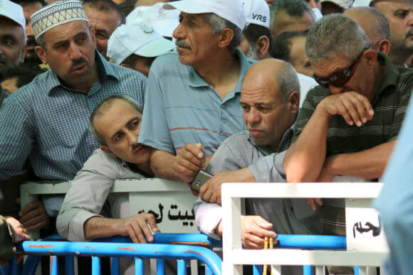 Palestinians stand in lines at the Bethlehem 300 military checkpoint, May, 2019.