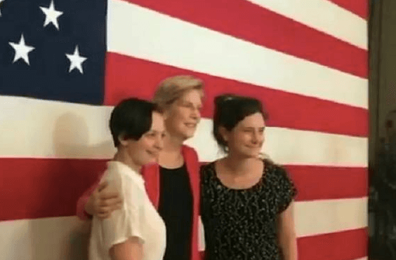 Elizabeth Warren poses for a photo with IfNotNow activists Becca Lubow and Ella Parker