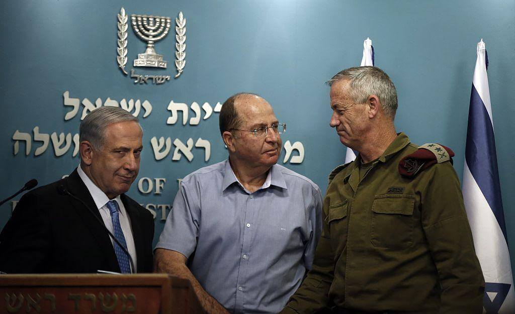 Benjamin Netanyahu next to the former Defense Minister Moshe Yaalon and then Chief of Staff General Benny Gantz (R) on 27 August 2014.