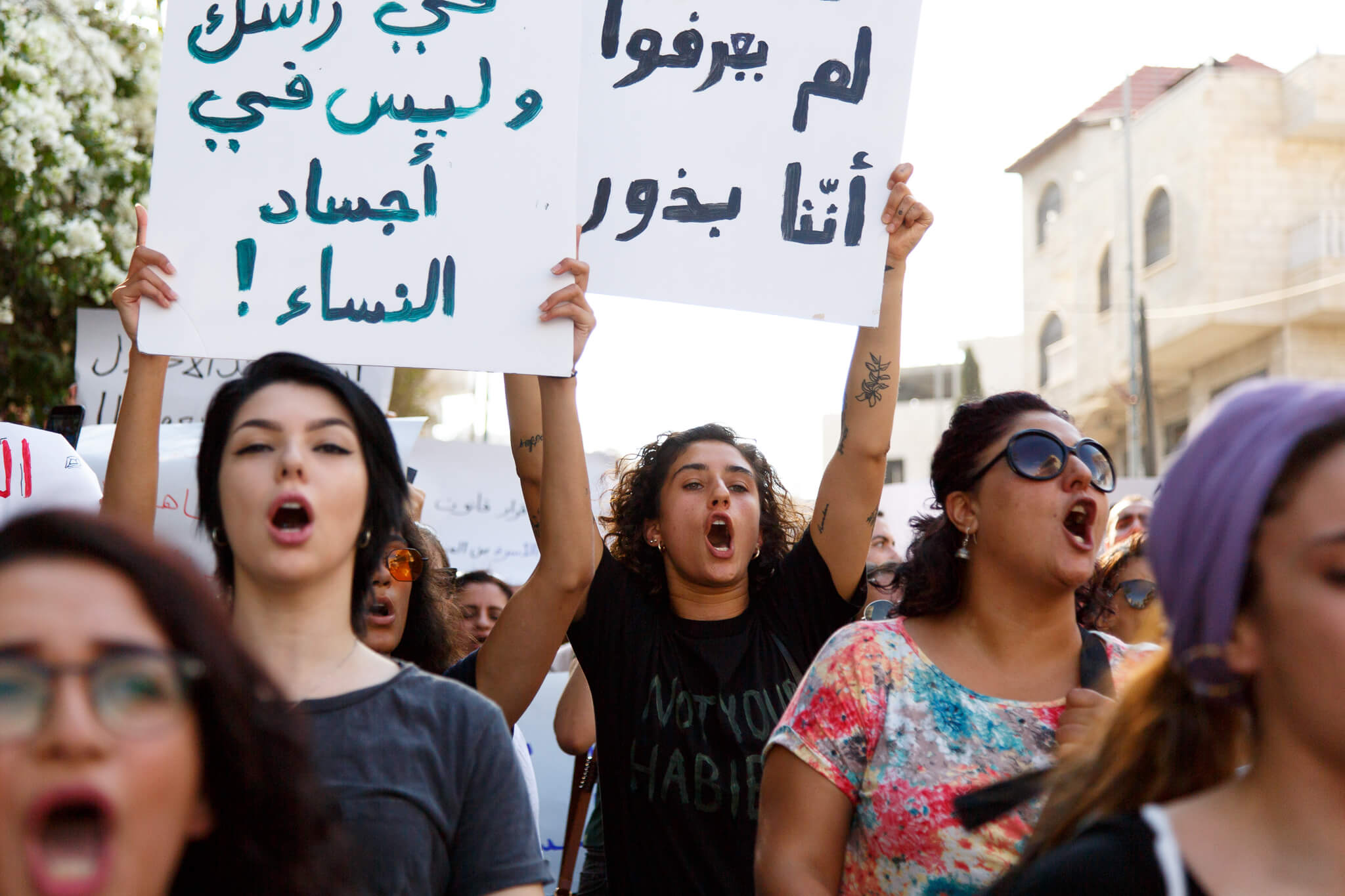 Founder of feminist clothing store Baby Fist, Palestinian-American Yasmeen Mjalli (center), 23, marches with a group of 100 protesters in Bethlehem. (Photo: Miriam Deprez)
